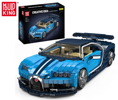 Blue toy car model with open roof and detailed interior, displayed in front of Mould King packaging.